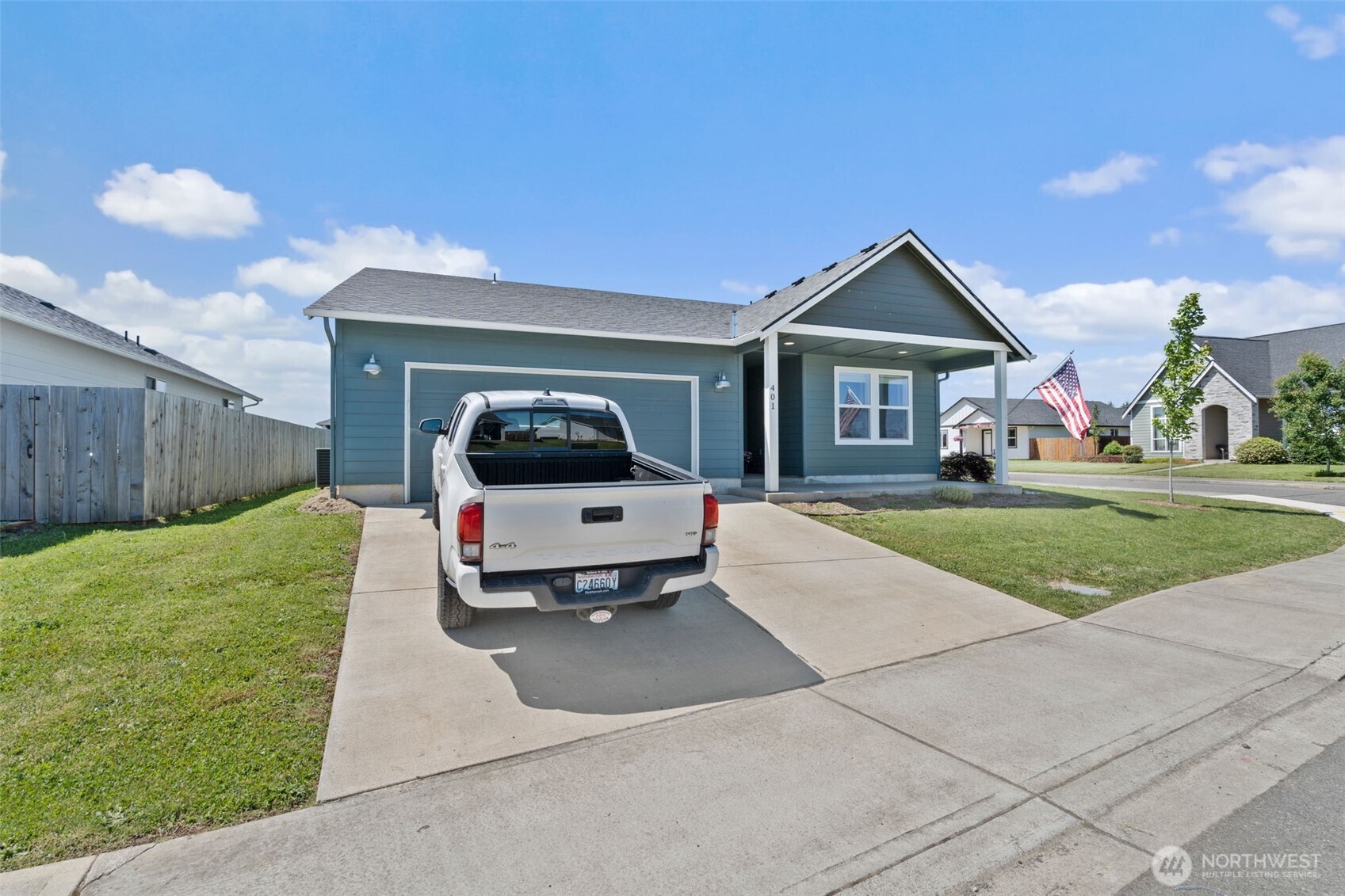 401 Cardinal Avenue Winlock, WA 98596 - Photo 37 of 39 a car parked in front of house with a yard