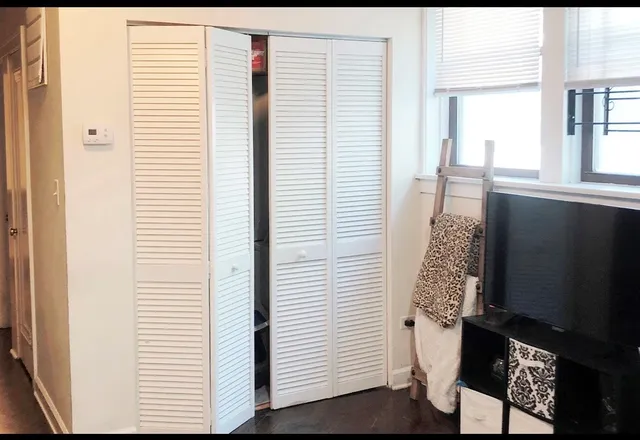 a view of a room that has a window in it