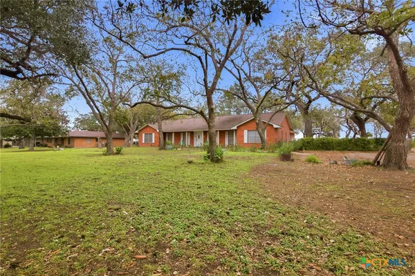 a view of house with yard