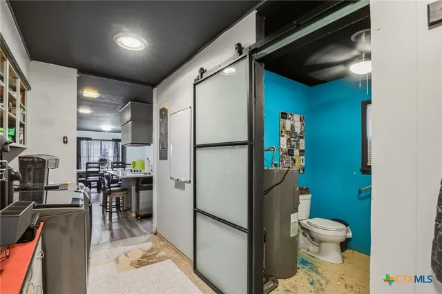 a kitchen with a refrigerator and a sink