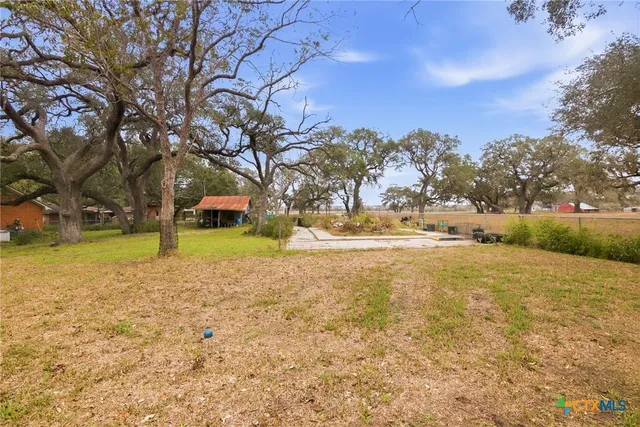 a house with trees in front of it