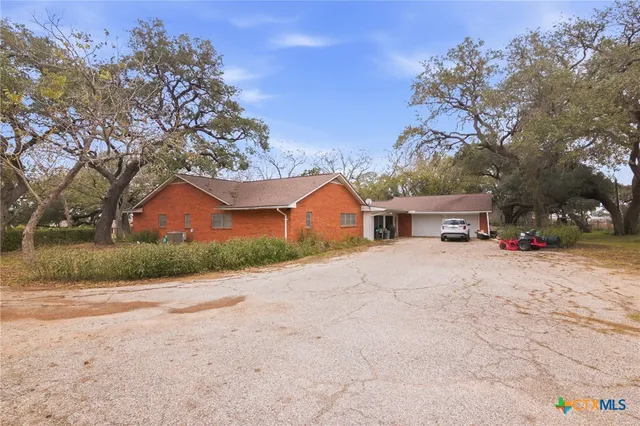 a view of lake with a house