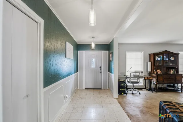 a view of a livingroom with walk in closet and bedroom