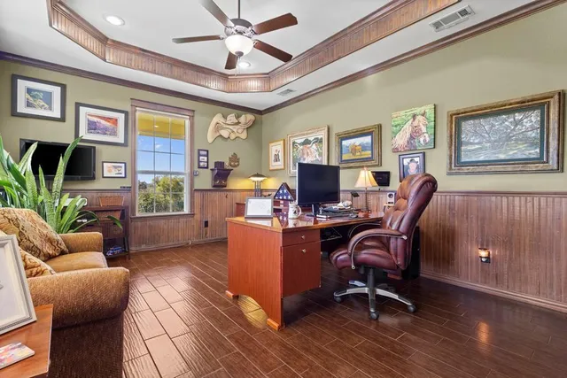 a view of a workspace with furniture and a livingroom