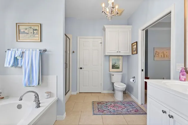 a bathroom with a bathtub sink and toilet