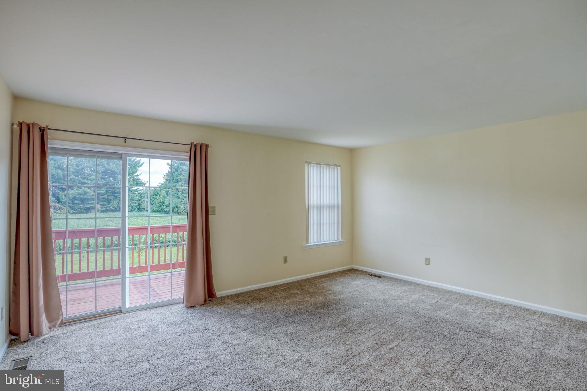197 Bonnybrook Road Middletown, DE 19709 - Photo 12 of 32 a view of an empty room with a window