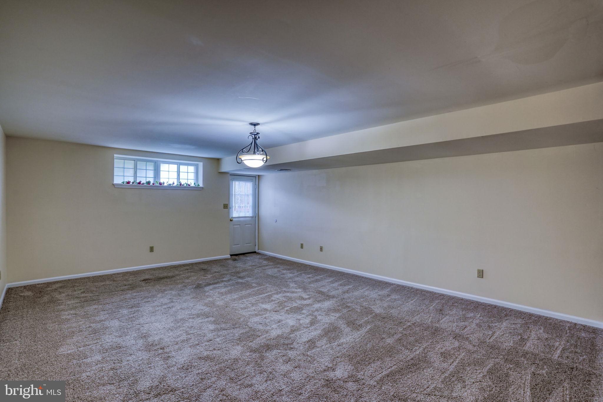 197 Bonnybrook Road Middletown, DE 19709 - Photo 23 of 32 an empty room with a empty space and windows