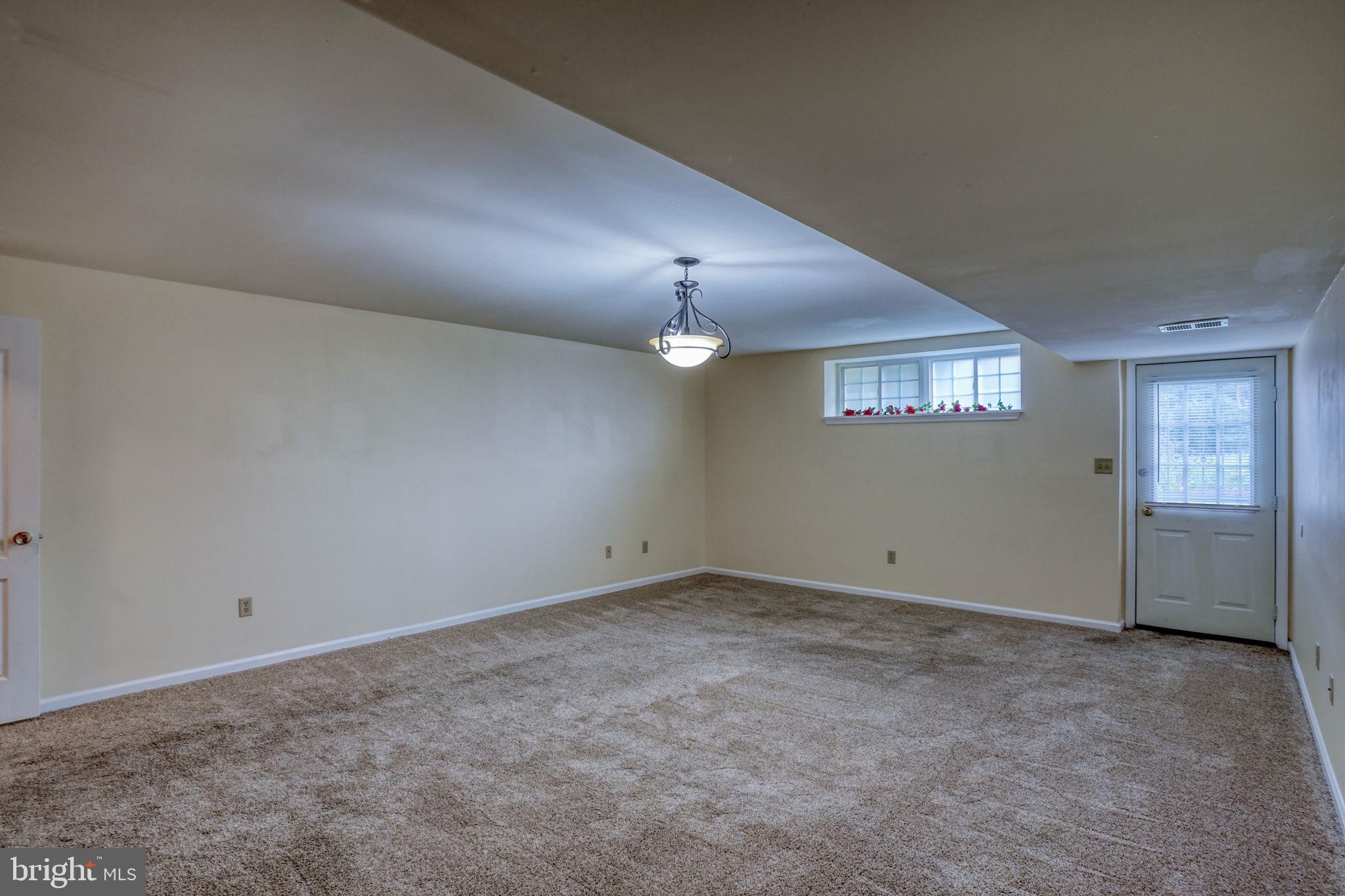 197 Bonnybrook Road Middletown, DE 19709 - Photo 24 of 32 an empty room with a empty space and windows