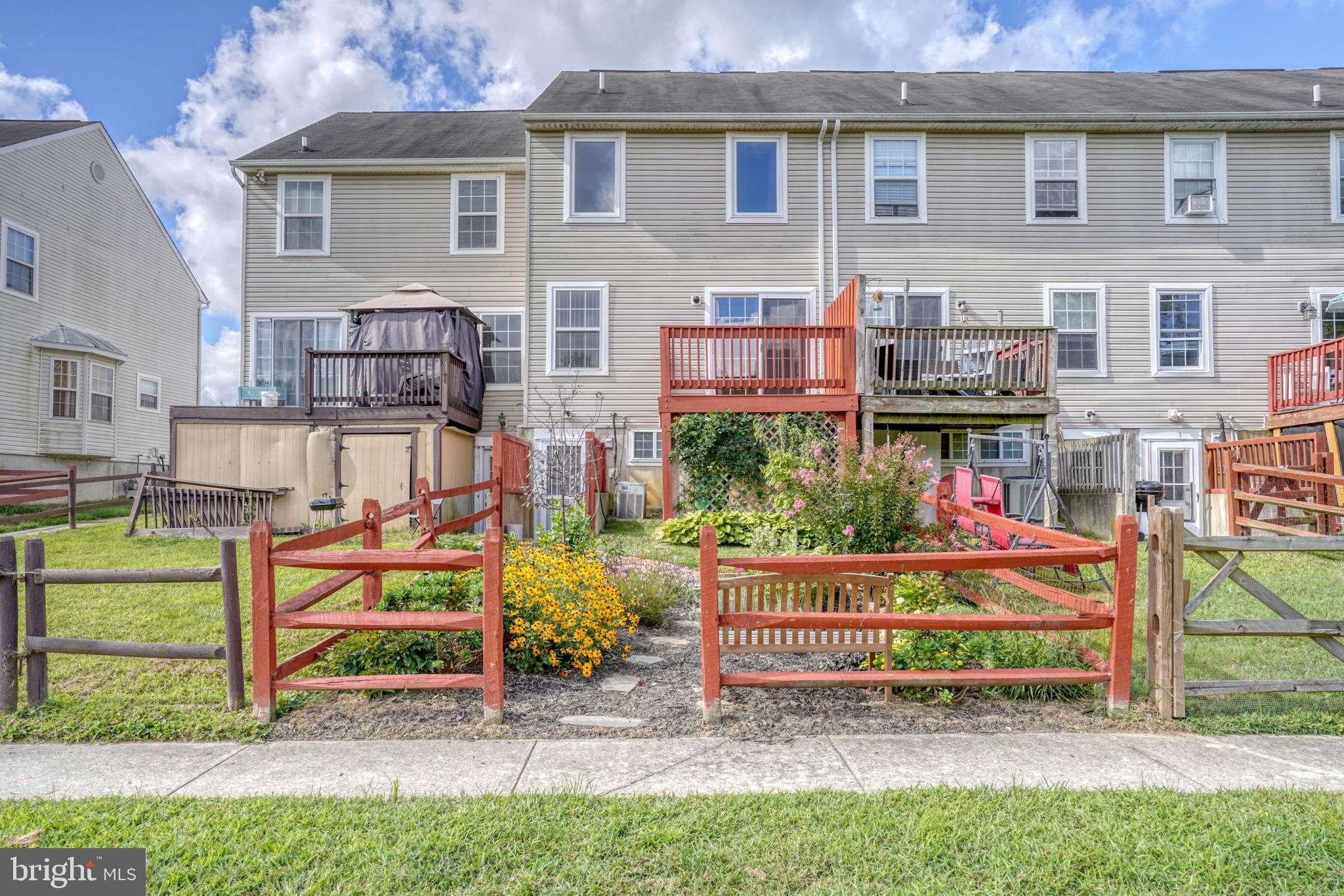 197 Bonnybrook Road Middletown, DE 19709 - Photo 30 of 32 a view of front of a house with a yard fire pit and outdoor seating