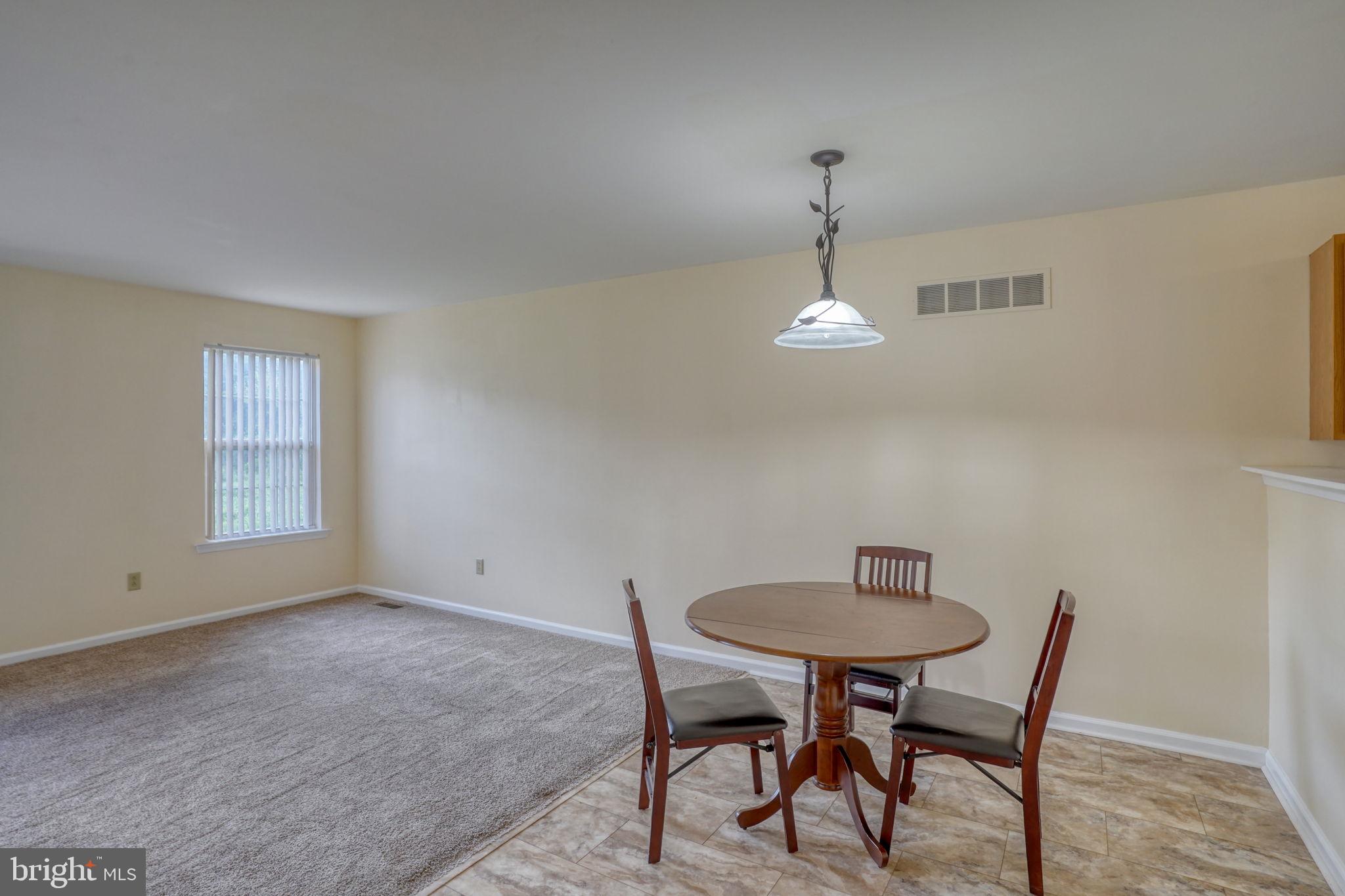 197 Bonnybrook Road Middletown, DE 19709 - Photo 9 of 32 a dining room with a table and chairs