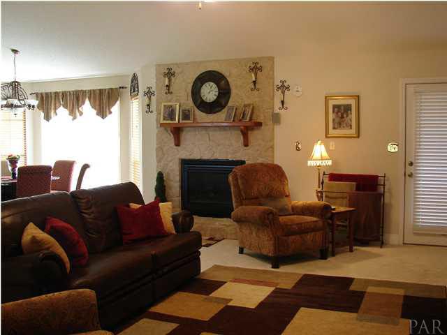 3675 Willard Norris Road Pace, FL 32571 - Photo 14 of 22 Another View of Living Room with a View of Gas Stoned Fireplace