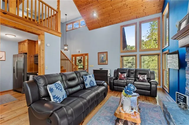 a view of a patio with table and chairs with wooden fence