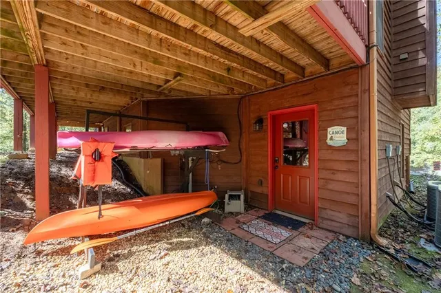 a view of balcony with furniture and umbrella
