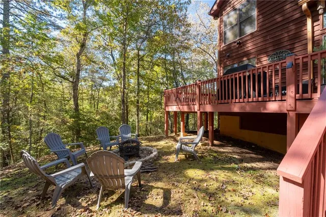 a living room with furniture and large windows