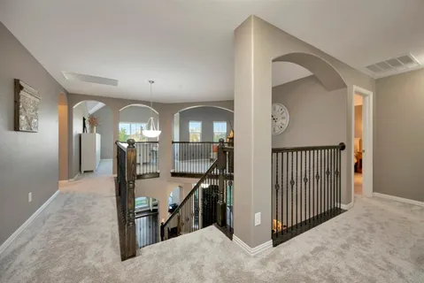 en view interior of a house with wooden floor and windows