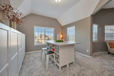 a kitchen with refrigerator and window