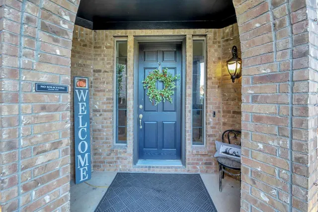 a view of outdoor space walk in closet and wooden floor