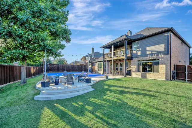 a view of a house with a yard porch and sitting area