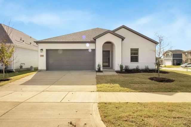 a view of a white house with a outdoor space