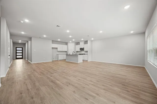 a view of kitchen with wooden floor