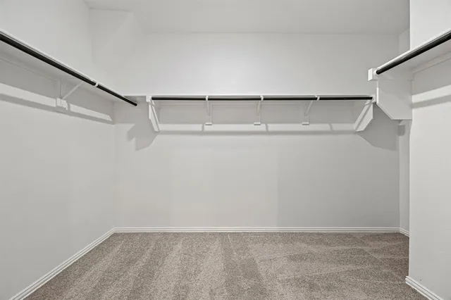 a view of hallway with wooden floor