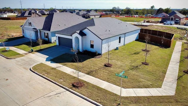 an aerial view of a house with a ocean view
