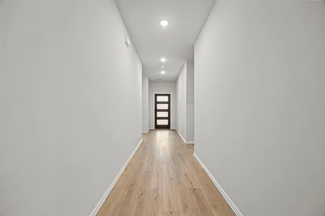 a view of kitchen with cabinets and wooden floor