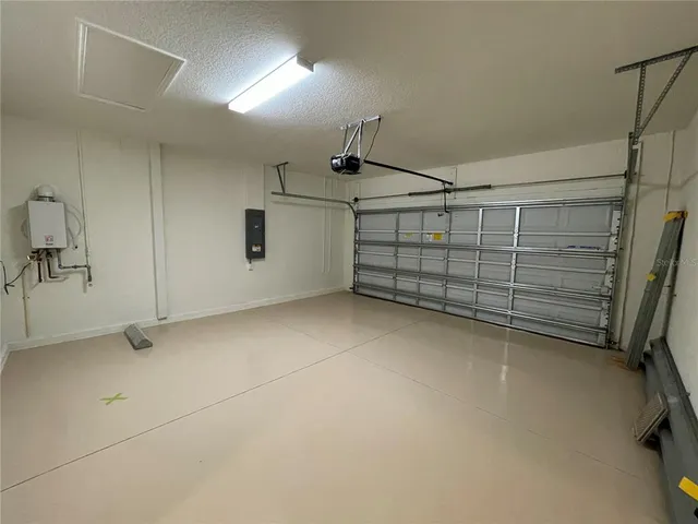 an aerial view of a house with a garden and swimming pool