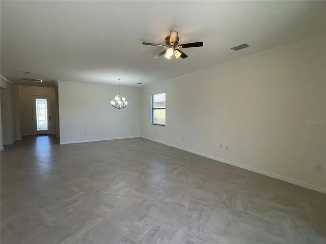 a view of a kitchen with a sink and a large window