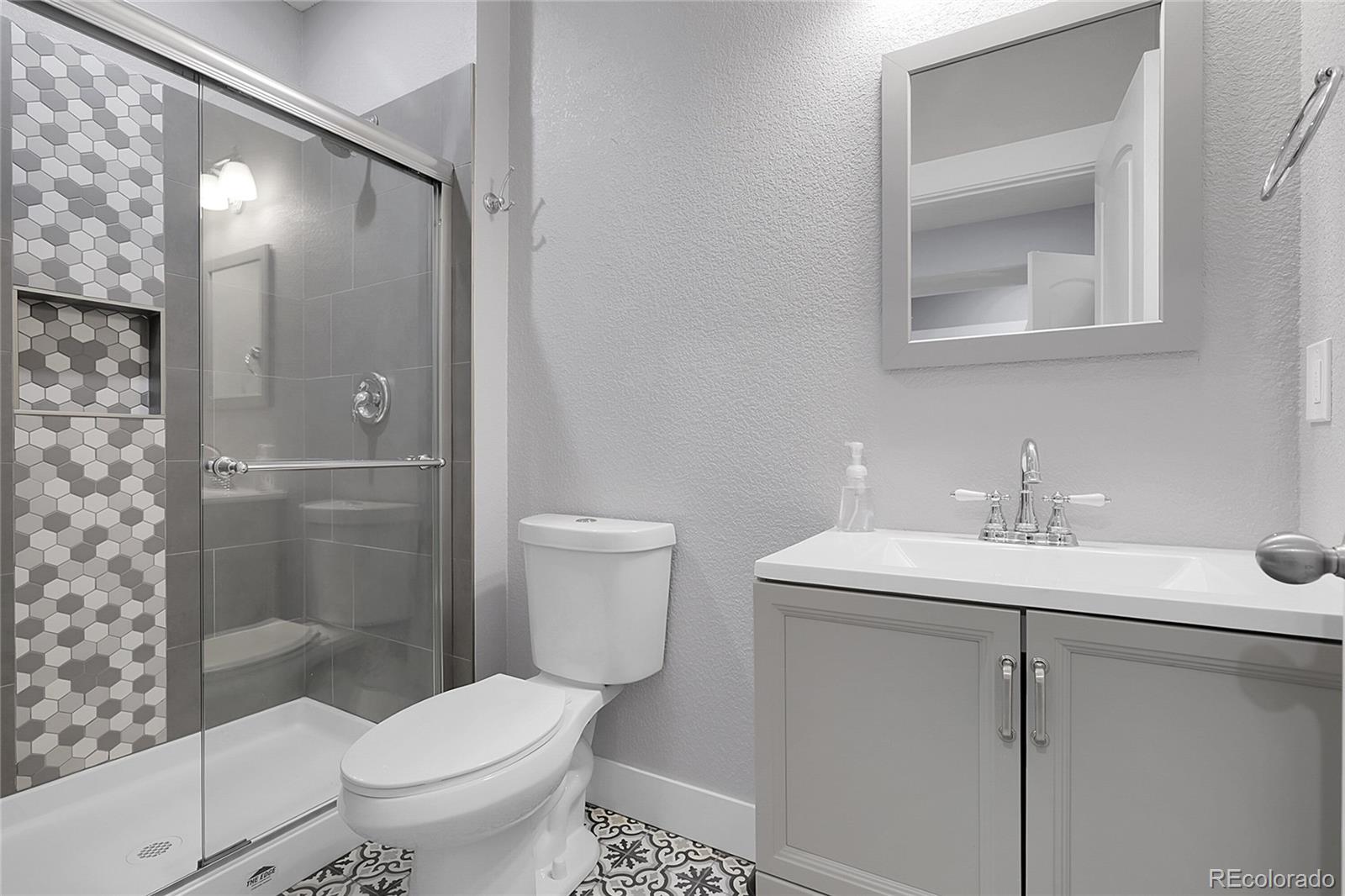 368 Dallas Street Denver, CO 80230 - Photo 24 of 39 a bathroom with a sink toilet and shower