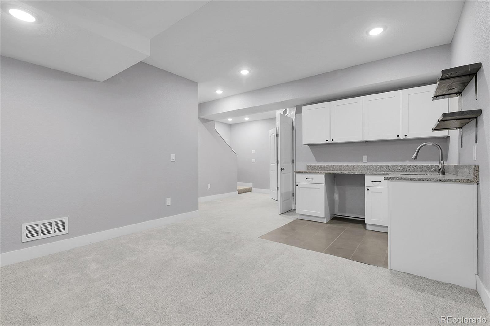 368 Dallas Street Denver, CO 80230 - Photo 27 of 39 a view of a kitchen with a sink and cabinets