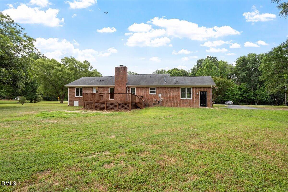 805 Rand Road Garner, NC 27529 - Photo 10 of 38 a front view of a house with a garden