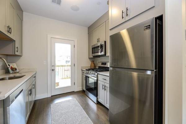 45 Clement Avenue, Unit 3 Boston, MA 02132 - Photo 11 of 35 a kitchen with a refrigerator stove and sink