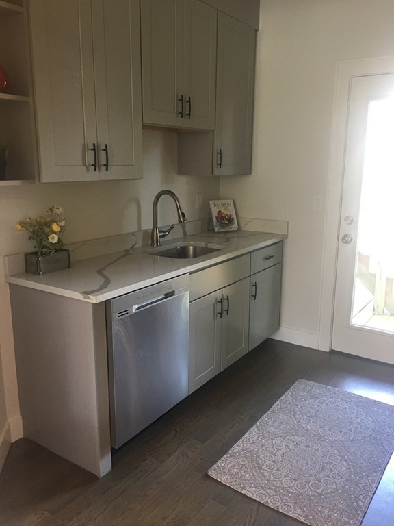 45 Clement Avenue, Unit 3 Boston, MA 02132 - Photo 13 of 35 a kitchen with a sink cabinets and a window