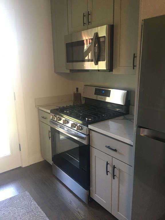 45 Clement Avenue, Unit 3 Boston, MA 02132 - Photo 14 of 35 a stove top oven sitting inside of a kitchen