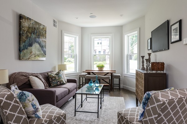 45 Clement Avenue, Unit 3 Boston, MA 02132 - Photo 2 of 35 a living room with furniture a couch and two windows