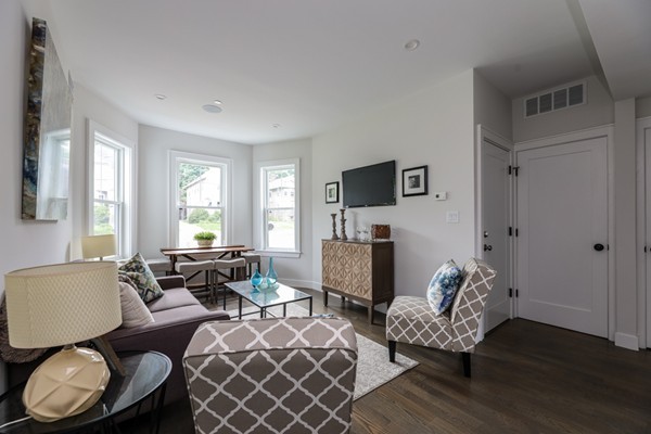 45 Clement Avenue, Unit 3 Boston, MA 02132 - Photo 5 of 35 a living room with furniture and a flat screen tv