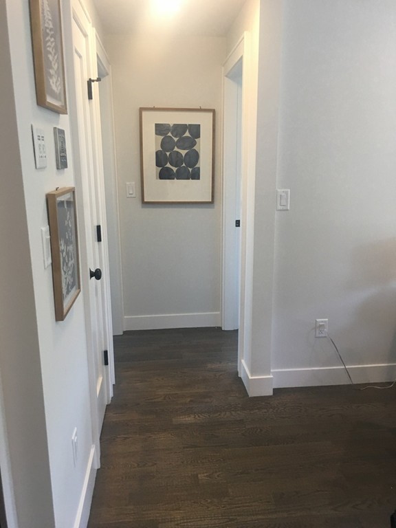 45 Clement Avenue, Unit 3 Boston, MA 02132 - Photo 9 of 35 a view of a hallway with a elevator