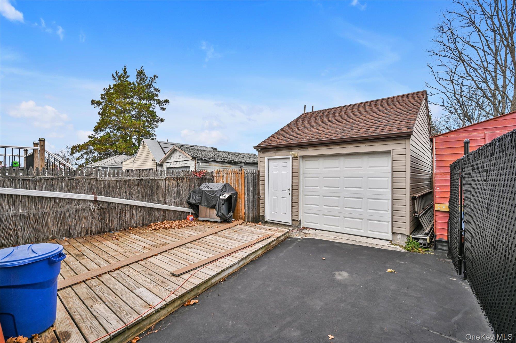 64-39 58th Road Queens, NY 11378 - Photo 17 of 19 a view of outdoor space and yard