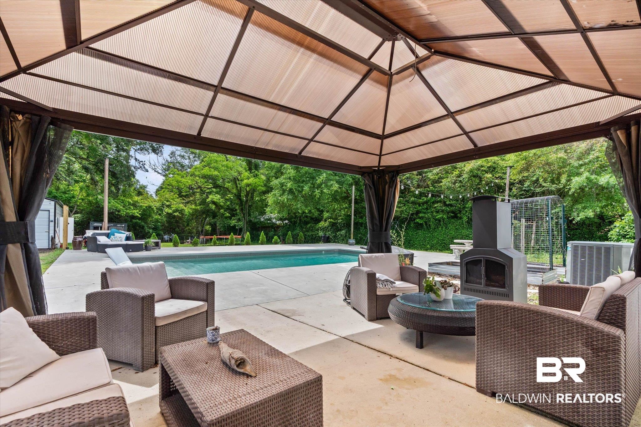 4213 Shan Drive East Mobile, AL 36693 - Photo 22 of 35 Outdoor covered patio featuring a built-in fireplace