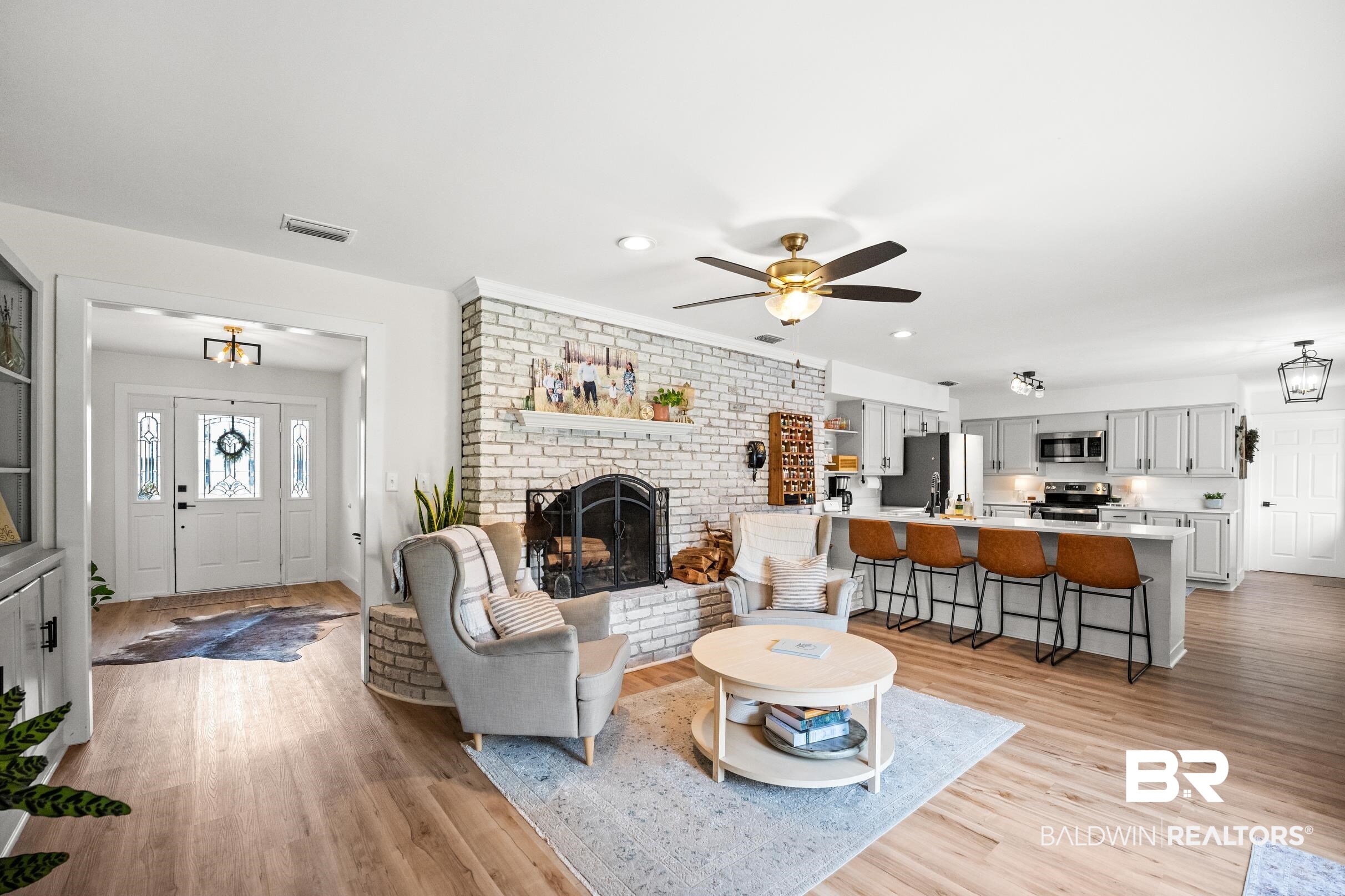 6 Wren Circle Foley, AL 36535 - Photo 14 of 55 Living area featuring light wood-style flooring, a fireplace, visible vents, and ceiling fan