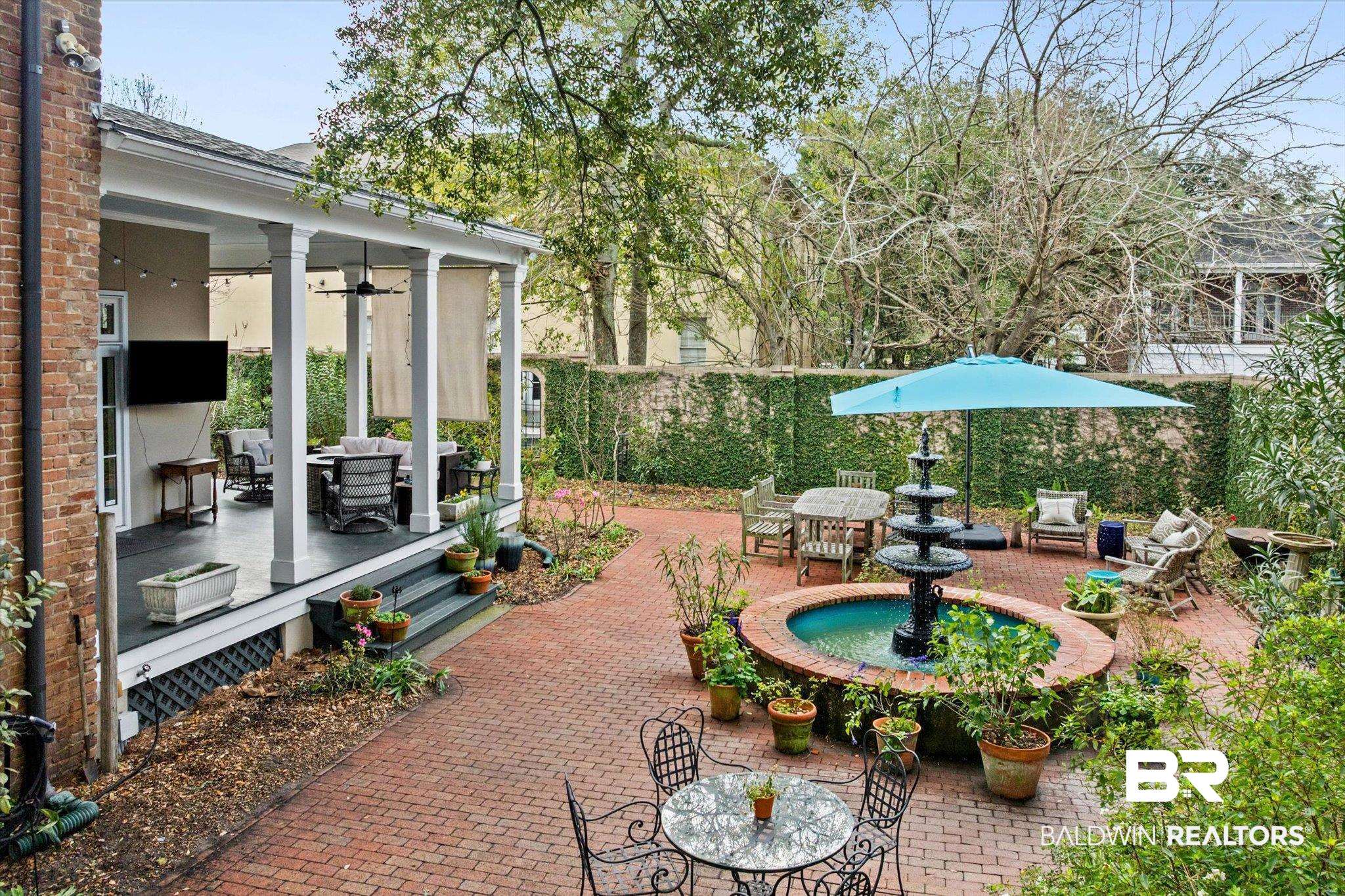 259 North Jackson Street Mobile, AL 36603 - Photo 19 of 42 View of patio / terrace featuring outdoor lounge area, outdoor dining area, a ceiling fan, and a sunroom