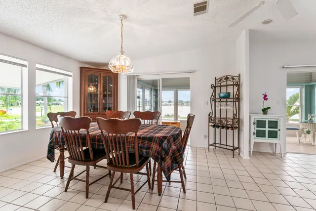 a view of a dining room with furniture window and outside view