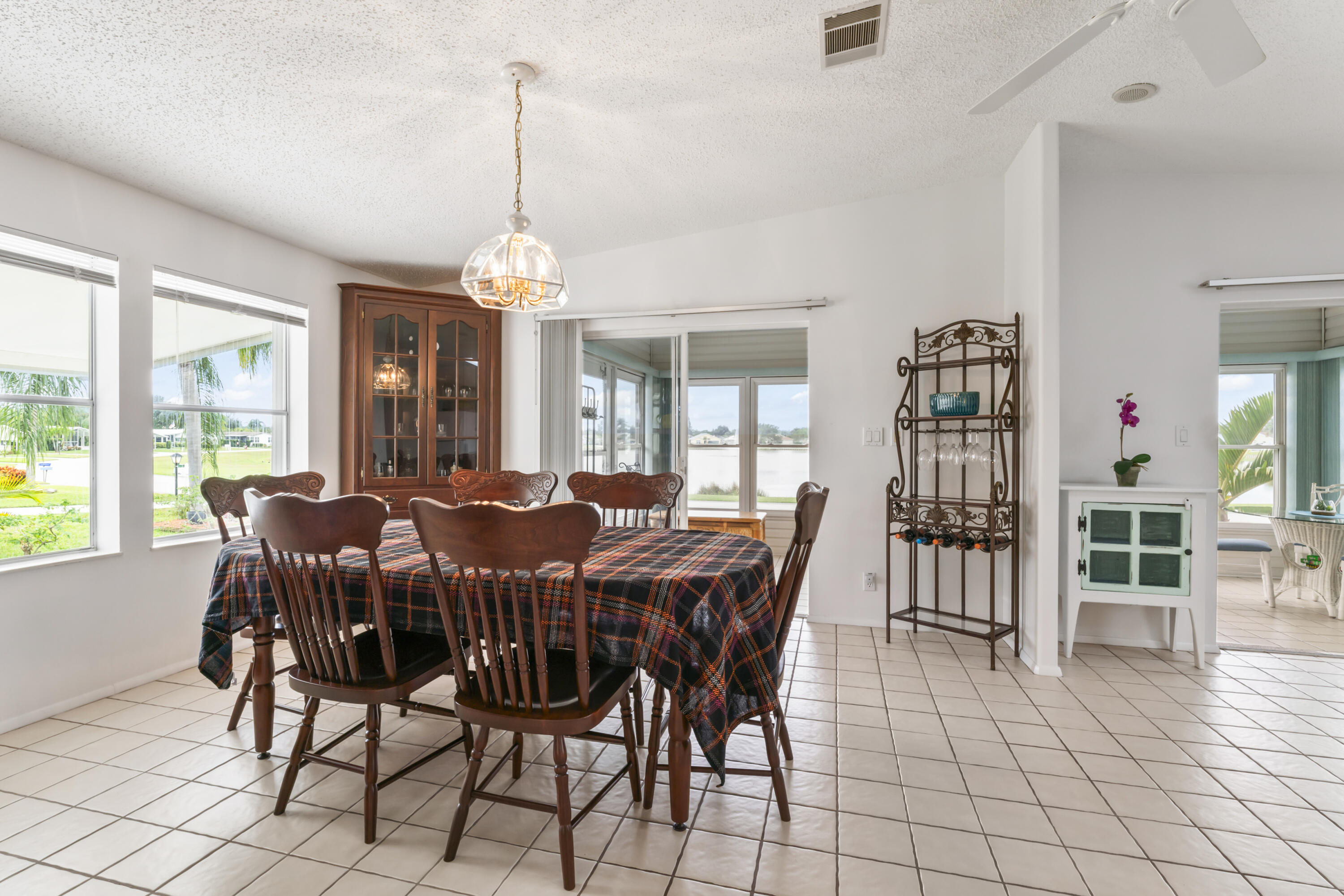 8913 Southwest Chevy Circle Stuart, FL 34997 - Photo 11 of 22 a view of a dining room with furniture window and outside view