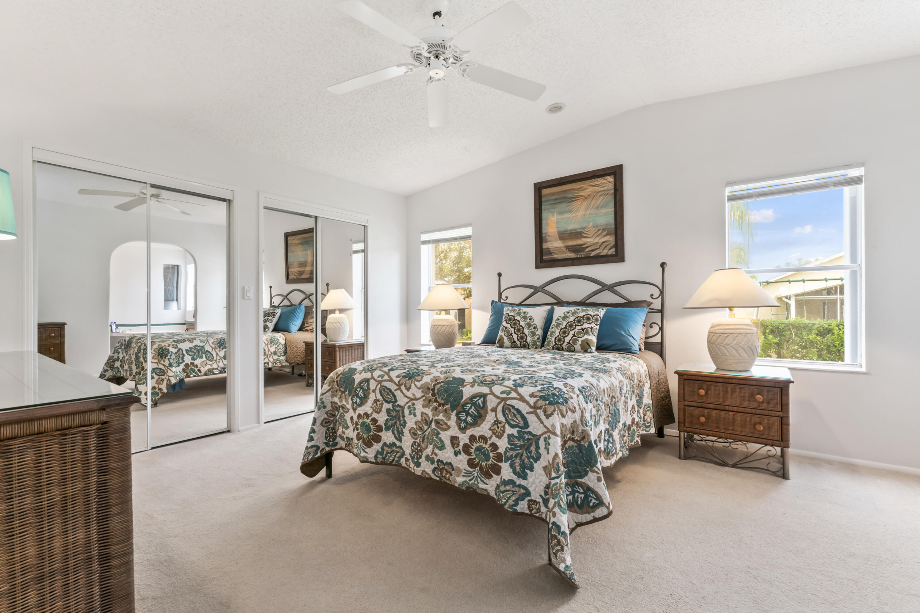 8913 Southwest Chevy Circle Stuart, FL 34997 - Photo 12 of 22 a spacious bedroom with a bed and dresser