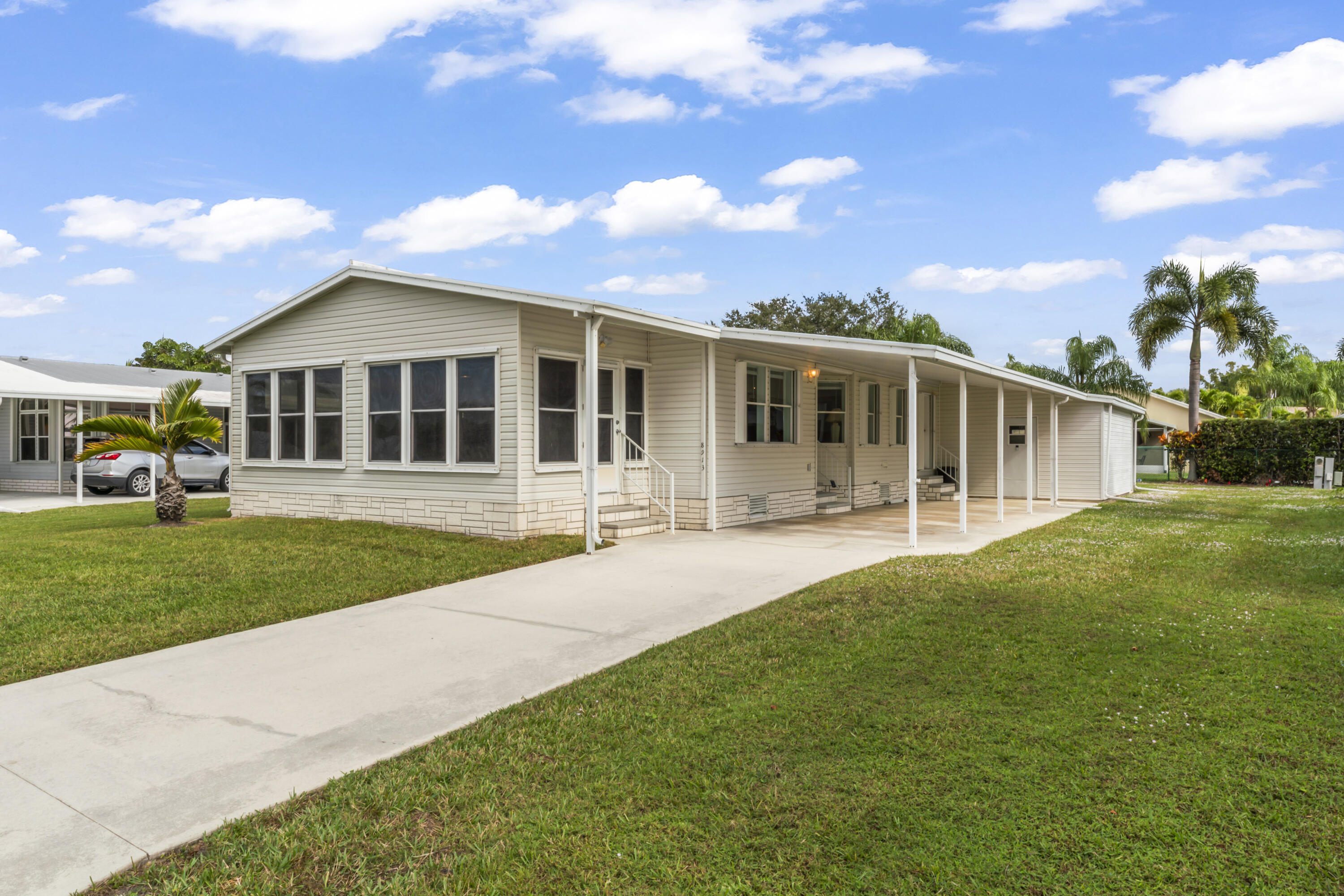 8913 Southwest Chevy Circle Stuart, FL 34997 - Photo 17 of 22 a view of a house with a backyard