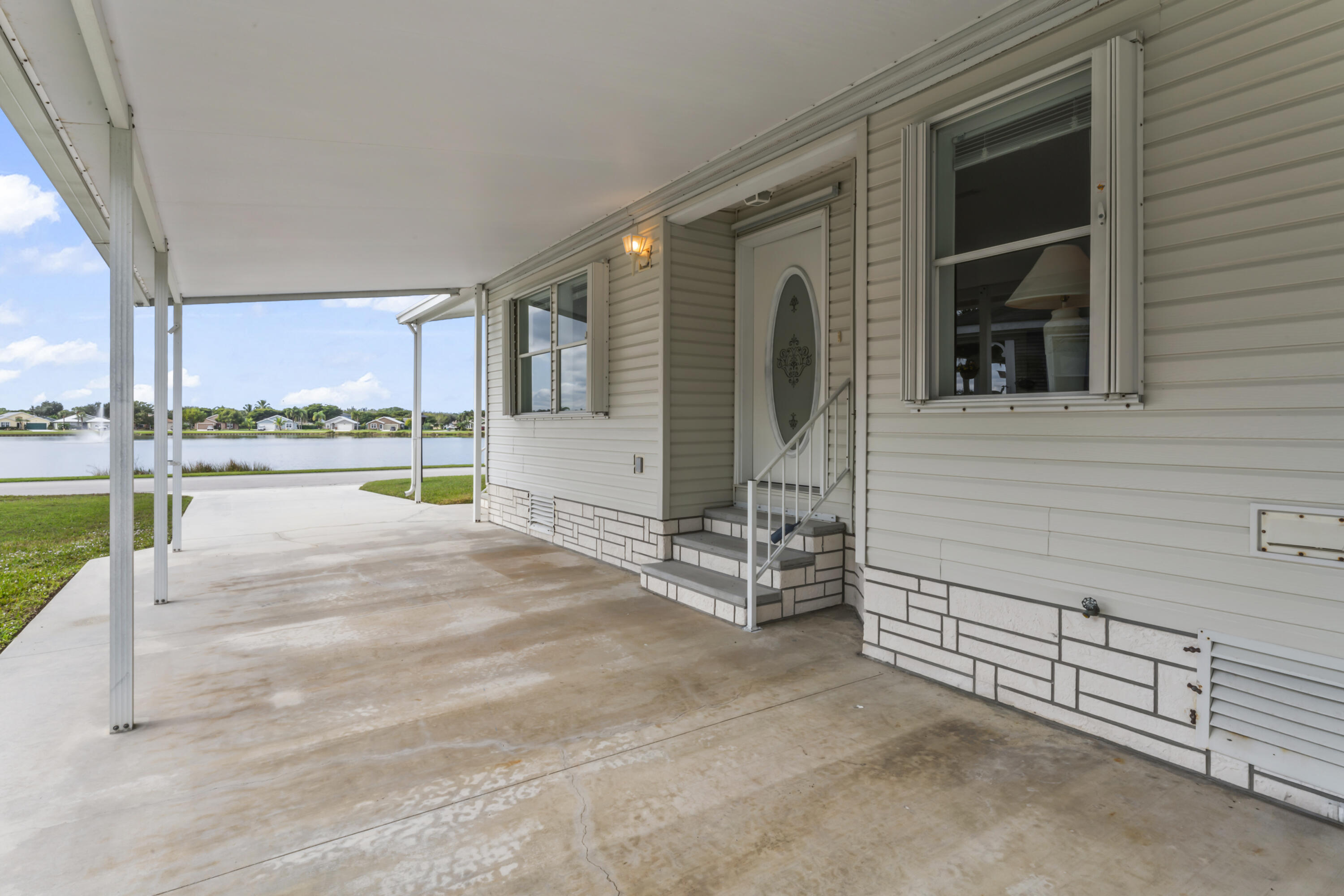 8913 Southwest Chevy Circle Stuart, FL 34997 - Photo 18 of 22 a view of a house with a outdoor space