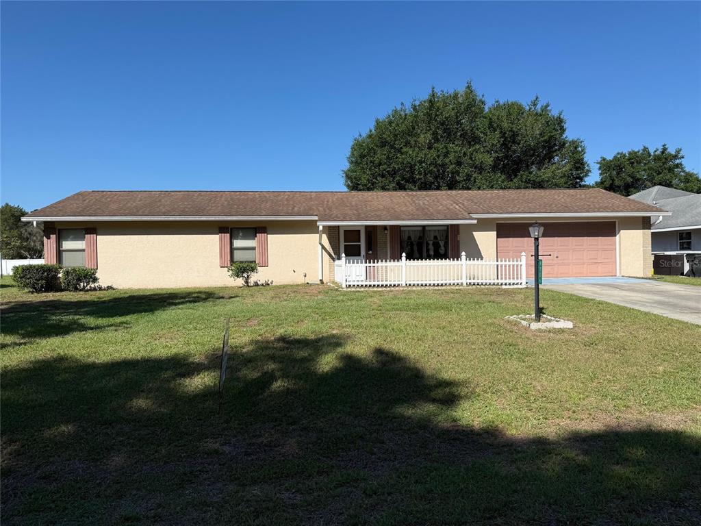 9706 Southwest 30th Terrace Ocala, FL 34476 - Photo 1 of 16 a view of a house with a backyard