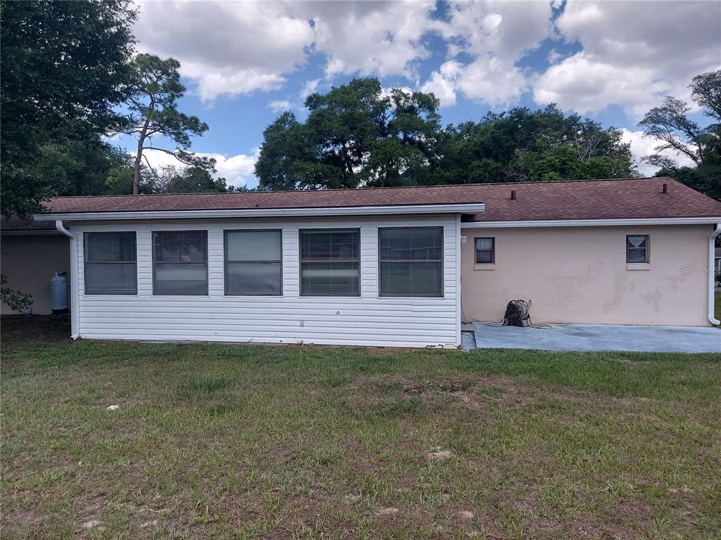 9706 Southwest 30th Terrace Ocala, FL 34476 - Photo 12 of 16 front view of a house with a yard