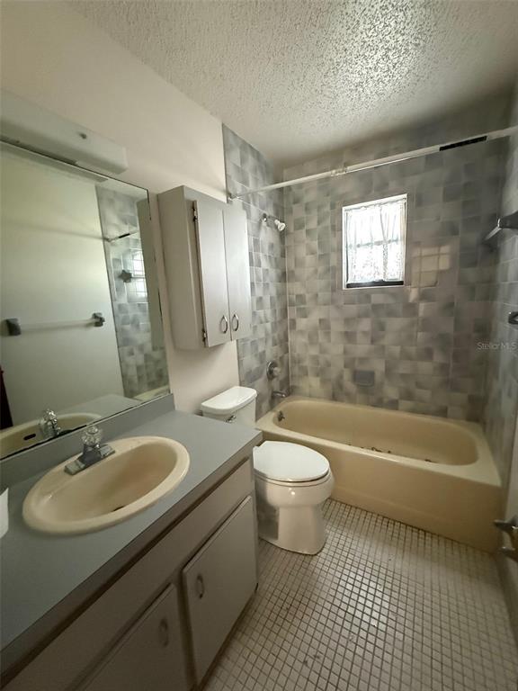9706 Southwest 30th Terrace Ocala, FL 34476 - Photo 10 of 16 a bathroom with a sink a toilet and bathtub